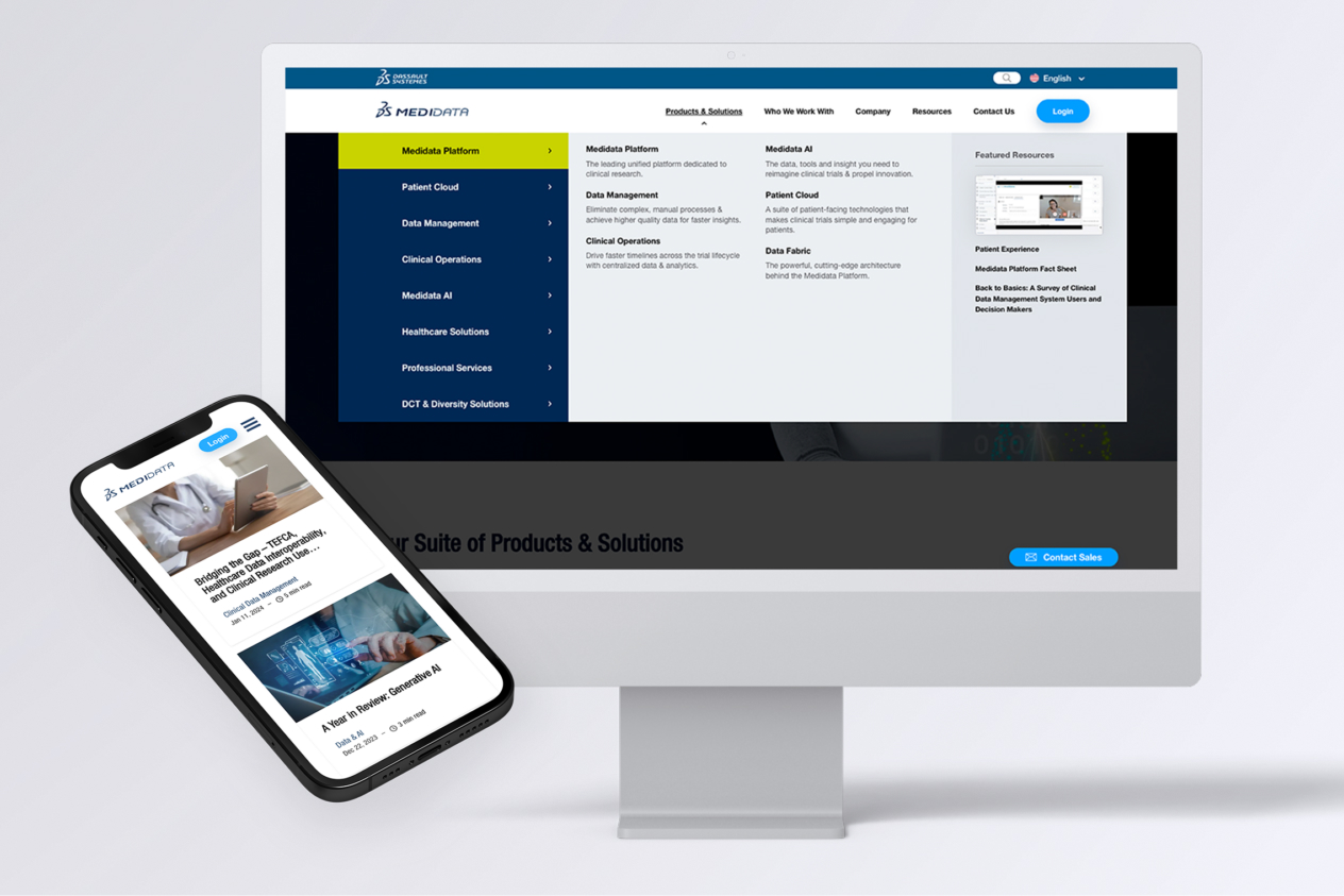 Computer monitor and smartphone displaying Medidata's website interface with various product and solution options.